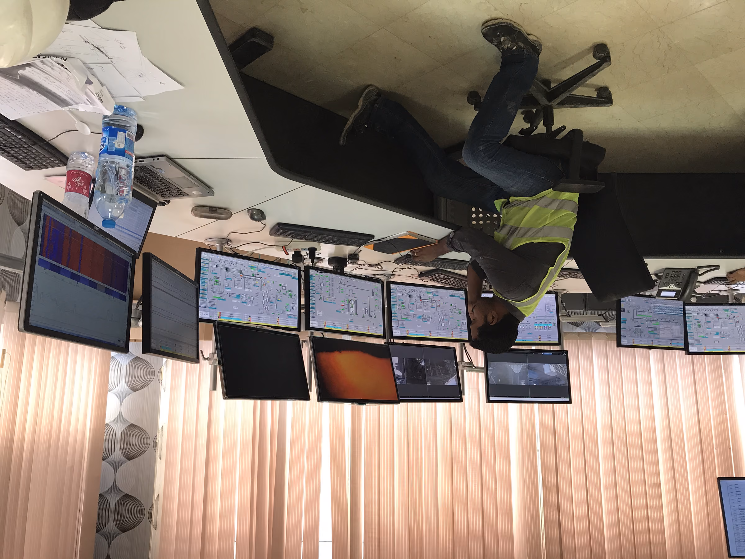 Control room operator at the desk of a cement plant