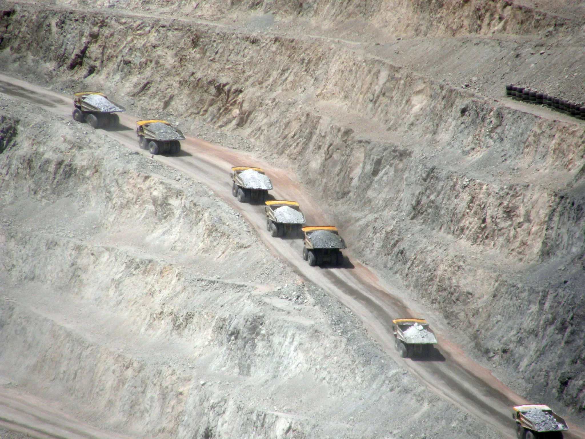 Haul trucks working an open pit mine