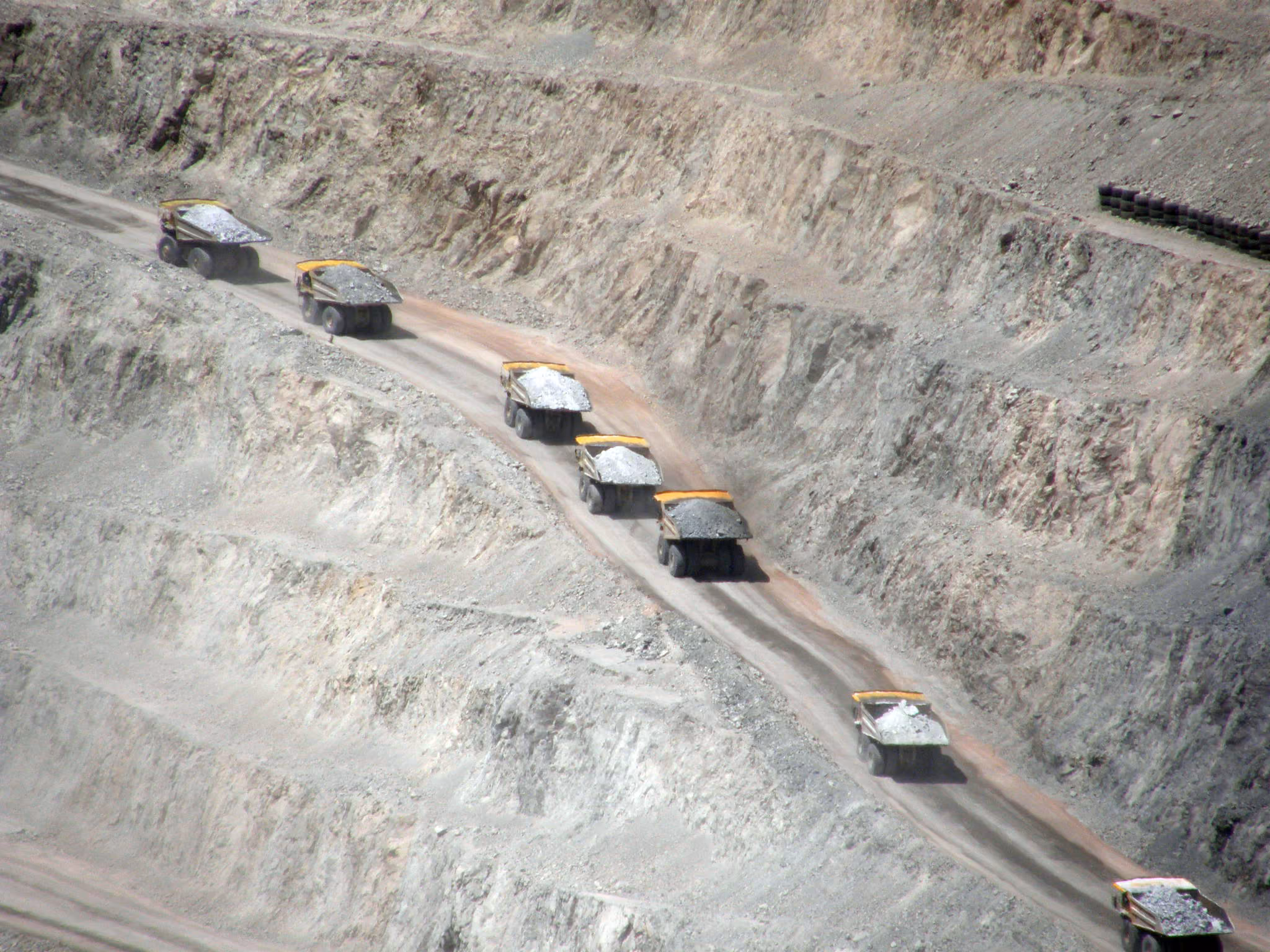 Haul trucks working an open pit mine