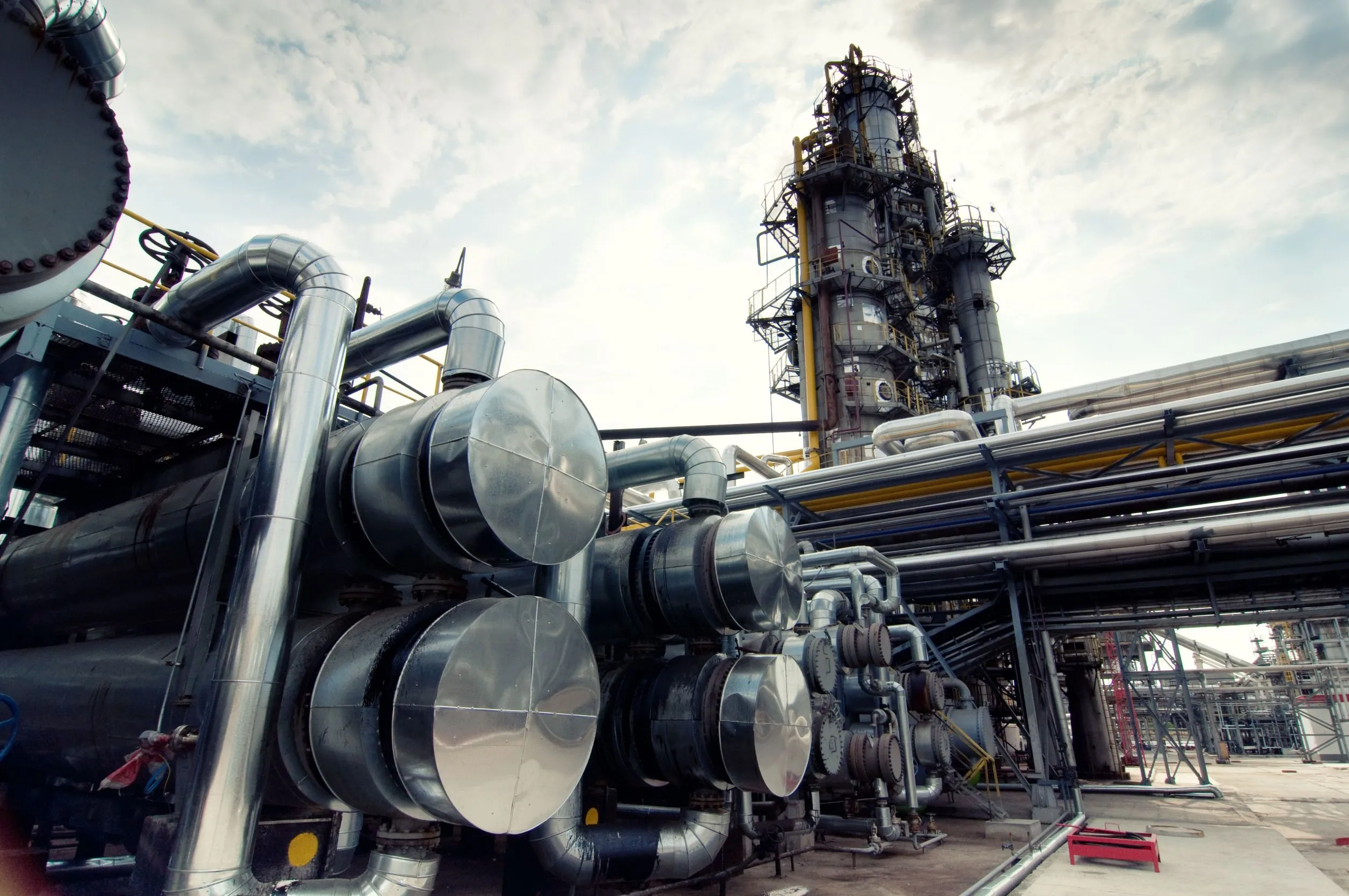 Piping and storage tanks at a petrochemical plant